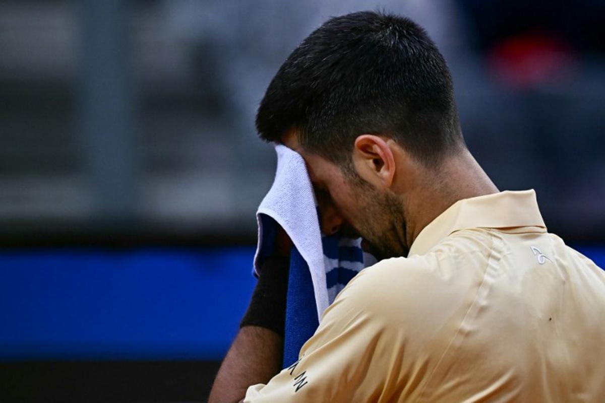 Serbia's Novak Djokovic reacts as he plays against Croatia's Dino Prizmic during their men's singles match of the WTA Rome Open tennis tournament at the Foro Italico in Rome on May 8, 2026. Filippo MONTEFORTE / AFP