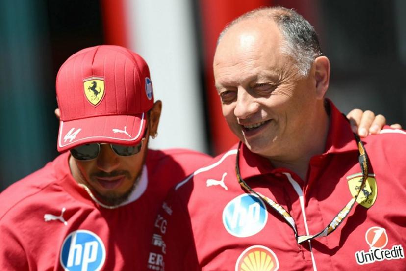 Ferrari's British driver Lewis Hamilton (L) and Ferrari's French team principal Frederic Vasseur speak ahead of the first practice session for the 2025 Emilia Romagna Formula One Grand Prix at the Imola autodrome in Imola, on May 16, 2025. Marco BERTORELLO / AFP