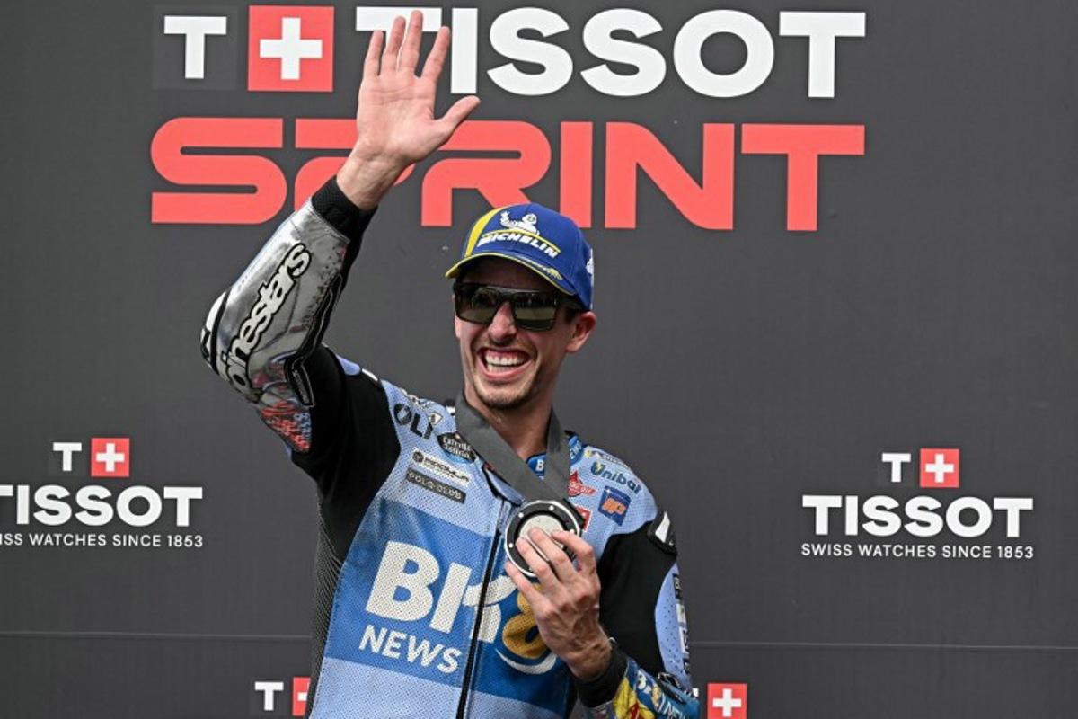 BK8 Gresini Racing MotoGP team's Spanish MotoGP rider Alex Marquez waves as he celebrates coming second place in the Sprint race in the MotoGP Malaysian Grand Prix at the Sepang International Circuit in Sepang on October 25, 2025. Lillian SUWANRUMPHA / AFP