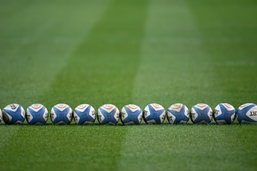 A picture shows rugby ball on the pitch of the Friuli stadium before the Autumn Nations Series international rugby union match between Italy and Australia (wallabies) in Udine on November 8, 2025. Stefano RELLANDINI / AFP