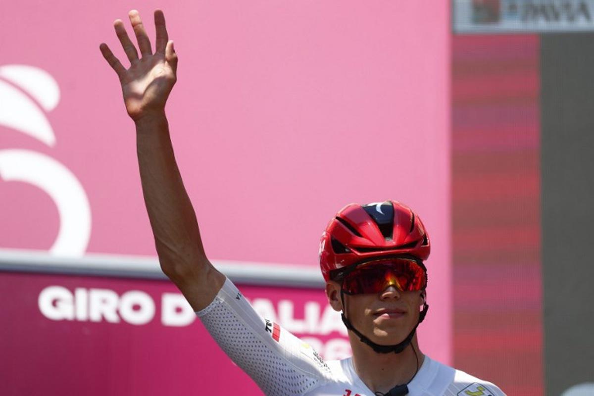 Soudal Quick-Step French rider Paul Magnier waves on stage before the 15th stage of the Giro d'Italia 2026 - Tour of Italy cycling race between Voghera and Milan, Italy, on May 24, 2026. Luca Bettini / AFP