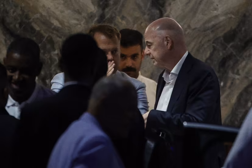 FIFA President Gianni Infantino (R) leaves Al-Madina Stadium in Rabat following the 2026 Women's Africa Cup of Nations match between Malawi and Zambia on August 5, 2026. Infantino, under fire for a now shelved plan to open the World Cup to private investment, earlier held emergency talks in Morocco with directors of the world football governing body. FIFA then issued an apology while reaffirming its "full support" for Infantino. In a statement, the leadership acknowledged "that errors were also made after the proposal was leaked to media". Abdelmajid BZIOUAT / AFP