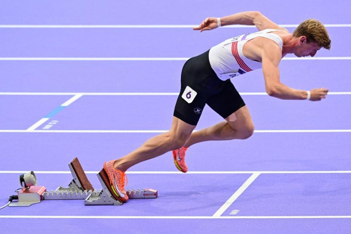 Belgium's Alexander Doom starts in the men's 400m semi-final of the athletics event at the Paris 2024 Olympic Games at Stade de France in Saint-Denis, north of Paris, on August 6, 2024. Martin BERNETTI / AFP