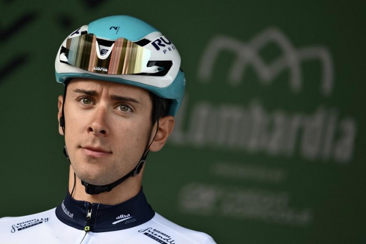 Bahrain Victorious's Italian riderAntonio Tiberi looks on from the sign-in podium ahead of the 119th edition of the Giro di Lombardia (Tour of Lombardy), a 238km cycling race from Como to Bergamo on October 11, 2025. Marco BERTORELLO / AFP