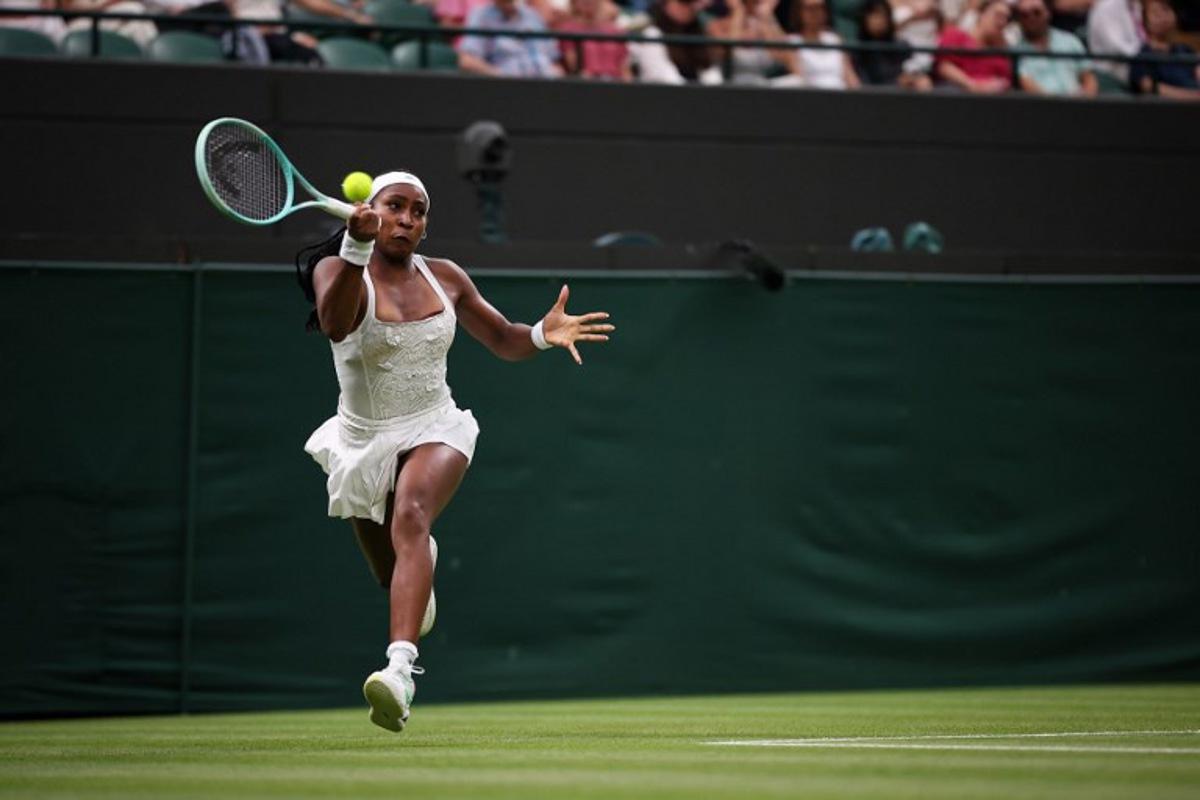 US player Coco Gauff plays a forehand return to Ukraine's Dayana Yastremska during their women's singles first round tennis match on the second day of the 2025 Wimbledon Championships at The All England Lawn Tennis and Croquet Club in Wimbledon, southwest London, on July 1, 2025. HENRY NICHOLLS / AFP