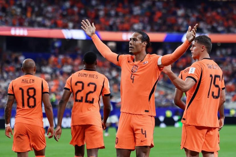 Netherlands' defender #04 Virgil van Dijk (C) celebrates after scoring the opening goal during the 2026 World Cup Group F football match between the Netherlands and Japan at the Dallas Stadium in Arlington on June 14, 2026. Aric Becker / AFP