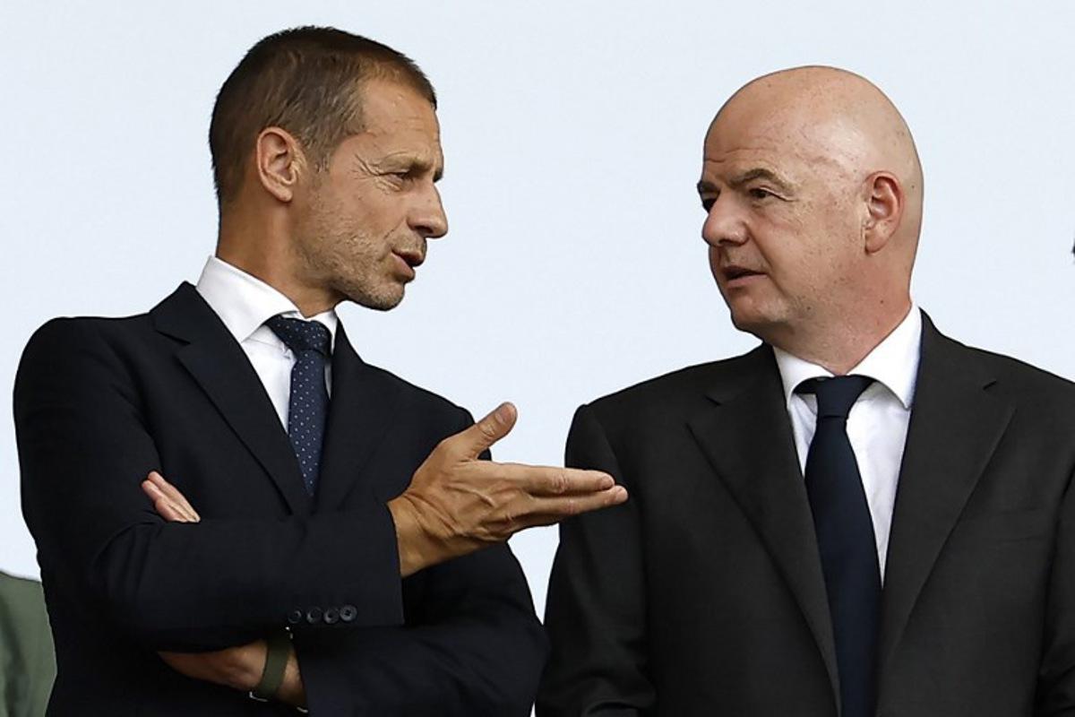 UEFA president Aleksander Ceferin (L) speaks with Fifa president Gianni Infantino before the start of the UEFA Euro 2024 round of 16 football match between Switzerland and Italy at the Olympiastadion Berlin in Berlin on June 29, 2024. Odd ANDERSEN / AFP