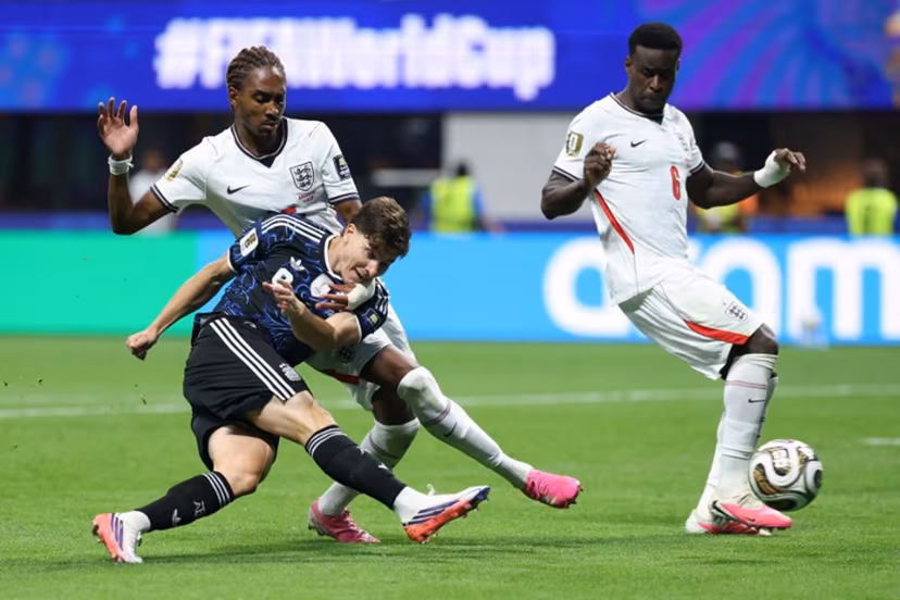 Argentina's forward #09 Julian Alvarez and England's defender #25 Djed Spence fight for the ball next to England's defender #06 Marc Guehi during the 2026 World Cup football tournament semi-final match between England and Argentina at the Atlanta Stadium in Atlanta on July 15, 2026. Thomas COEX / AFP
