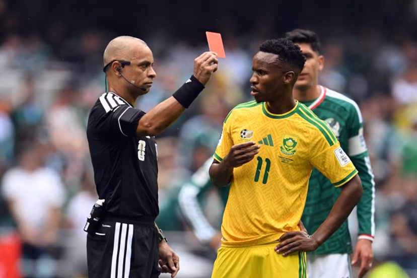 Brazilian referee Wilton Sampaio shows a red card to South Africa's midfielder #11 Themba Zwane during the 2026 World Cup Group A football match between Mexico and South Africa at the Mexico City Stadium in Mexico City on June 11, 2026. Yuri CORTEZ / AFP