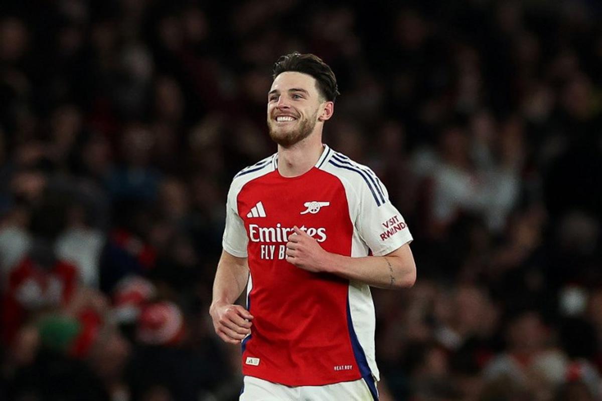 Arsenal's English midfielder #41 Declan Rice celebrates scoring the team's second goal during the UEFA Champions League Quarter final first leg football match between Arsenal and Real Madrid, at the Emirates Stadium, in London, on April 8, 2025. Adrian Dennis / AFP