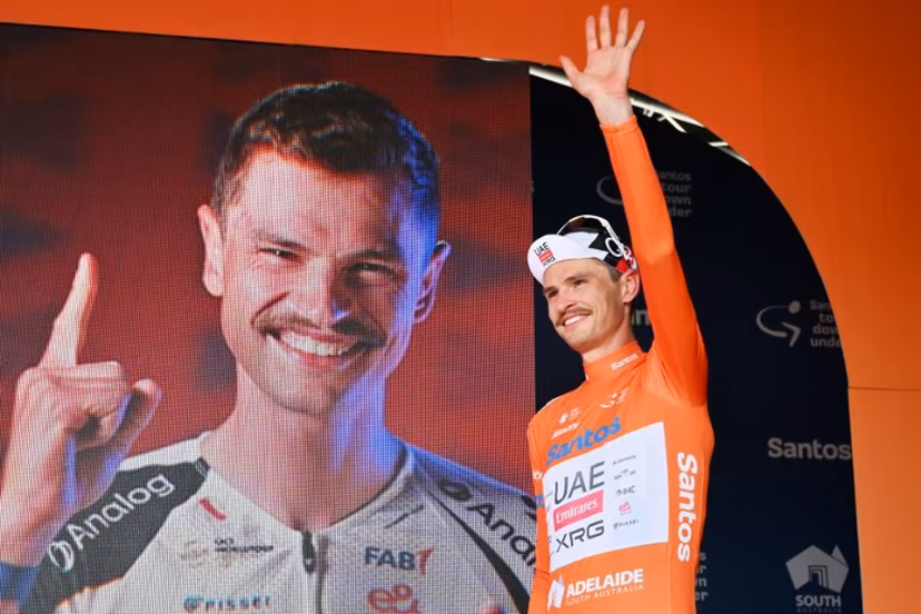 Race leader UAE Team Emirates XRG's Australian rider Jay Vine waves onstage as he continues to wear the leader's jersey after stage four of the Tour Down Under UCI men's cycling race in Adelaide on January 24, 2026. Brenton Edwards / AFP