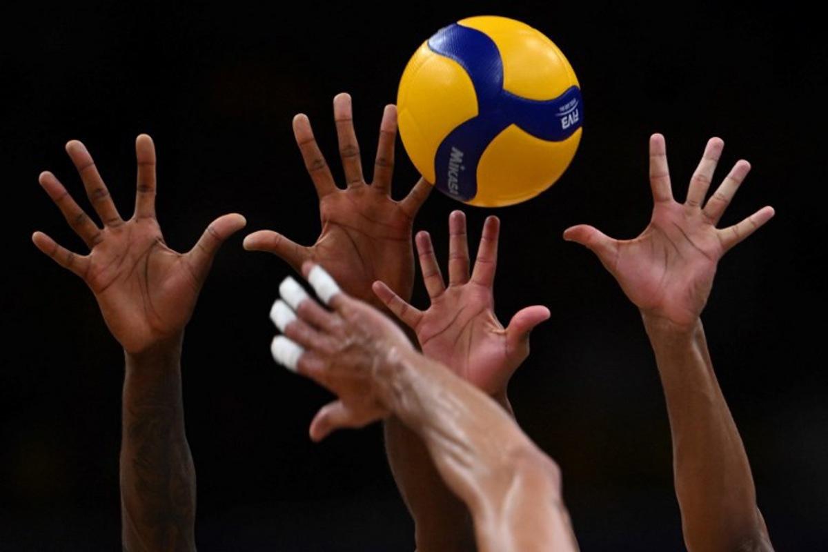 Argentina's Bruno Lima spikes the ball during the FIVB Volleyball Men's Nations League match between Brazil and Argentina at the Maracanazinho gymnasium in Rio de Janeiro, Brazil, on May 23, 2024. MAURO PIMENTEL / AFP