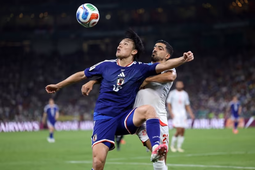 Japan's forward #18 Ayase Ueda and Tunisia's defender #21 Mohamed Ben Hamida fight for the ball during the 2026 World Cup Group F football match between Tunisia and Japan at the Monterrey Stadium in Guadalupe, Mexico, on June 20, 2026. Julio Cesar AGUILAR / AFP