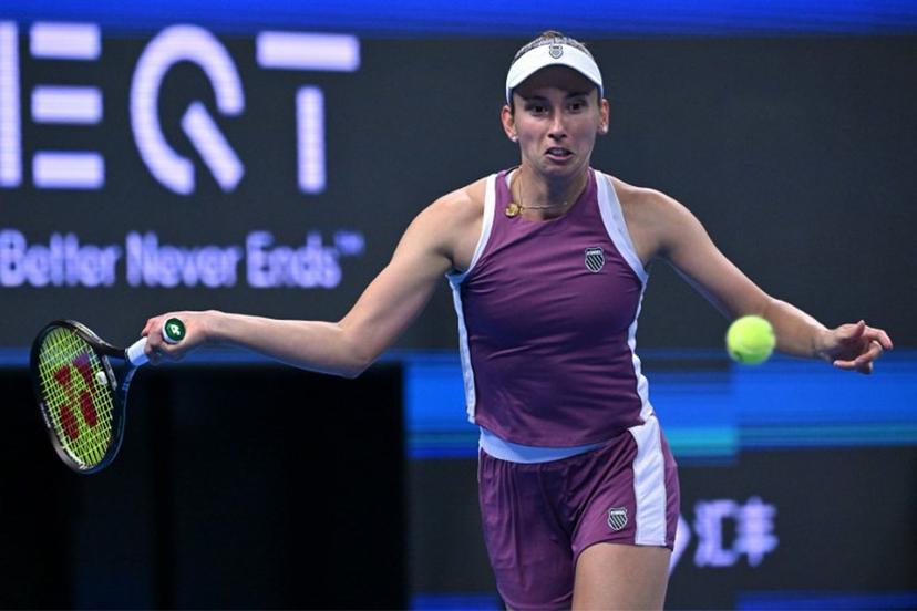 Belgium's Elise Martens hits a return to China's Zheng Qinwen during their semi-final match at the China Open tennis tournament in Beijing on October 10, 2026. ADEK BERRY / AFP