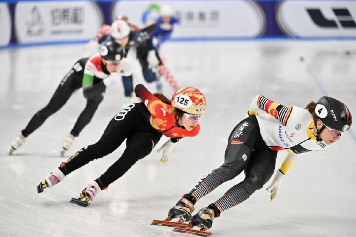 Belgium's Hanne Desmet (R) and China's Yang Jingru (2nd R) compete in the Women's 1,500 meter quarter-final at the 2025 ISU World Short Track Championships in Beijing on March 14, 2025. ADEK BERRY / AFP