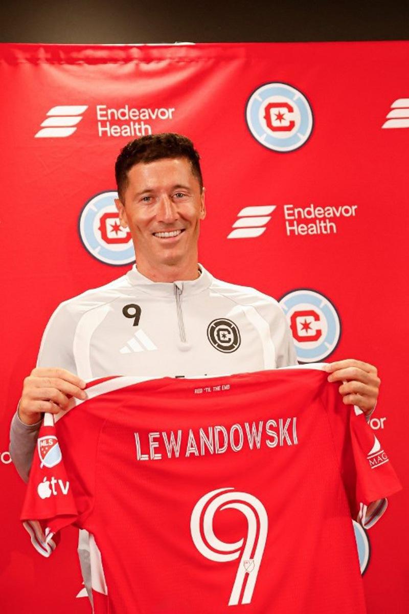 Polish forward #09 Robert Lewandowski is officially introduced during the press conference as a new member of the Chicago Fire FC at Endeavor Health Performance Center ahead of his MLS debut in Chicago, Illinois, on July 14 2026. Poland's all-time leading goal scorer Robert Lewandowski has signed a contract through the 2027-28 campaign with the Chicago Fire, the Major League Soccer club announced in late June 2026. The 37-year-old striker arrives from Barcelona after helping the Spanish giants capture the La Liga crown last month having starred from 2014-2022 with Bayern Munich. KAMIL KRZACZYNSKI / AFP