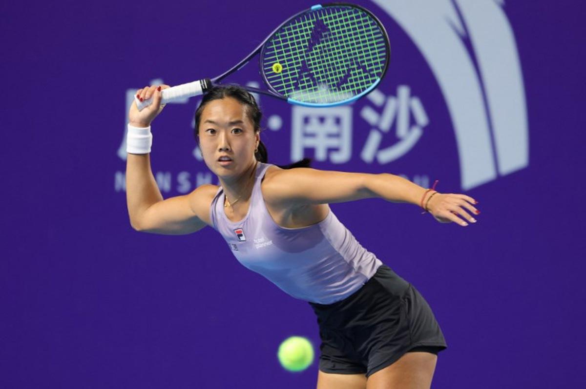 USA's Ann Li hits a return to Italy's Elisabetta Cocciaretto during their women's singles quarter-final match at the Guangzhou Open tennis tournament in Guangzhou, China's southern Guangdong province on October 24, 2025. -STR / AFP