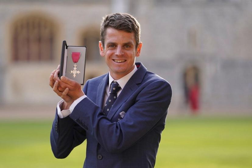 Athlete Jonathan Brownlee poses with his medal after being appointed a Member of the Order of the British Empire (MBE) during an investiture ceremony at Windsor, on October 18, 2022. Andrew Matthews / POOL / AFP