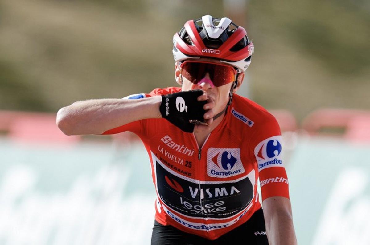 (FILES) Overall leader team Visma-Lease a bike's Danish rider Jonas Vingegaard celebrates winning the 20th stage of the Vuelta a Espana 2025, a 156 km race between Robledo de Chavela and Bola del Mundo, near Navacerrada, on September 13, 2025. The final stage of the Vuelta a Espana was abandoned on September 14, 2025 because of huge pro-Palestinian protests in Madrid, with Jonas Vingegaard crowned champion for the first time. The race's overall leader crossed first the finish line on the Bola del Mundo mountain the day before, which effectively sealed his victory in the Vuelta a Espana 2025. Oscar DEL POZO / AFP