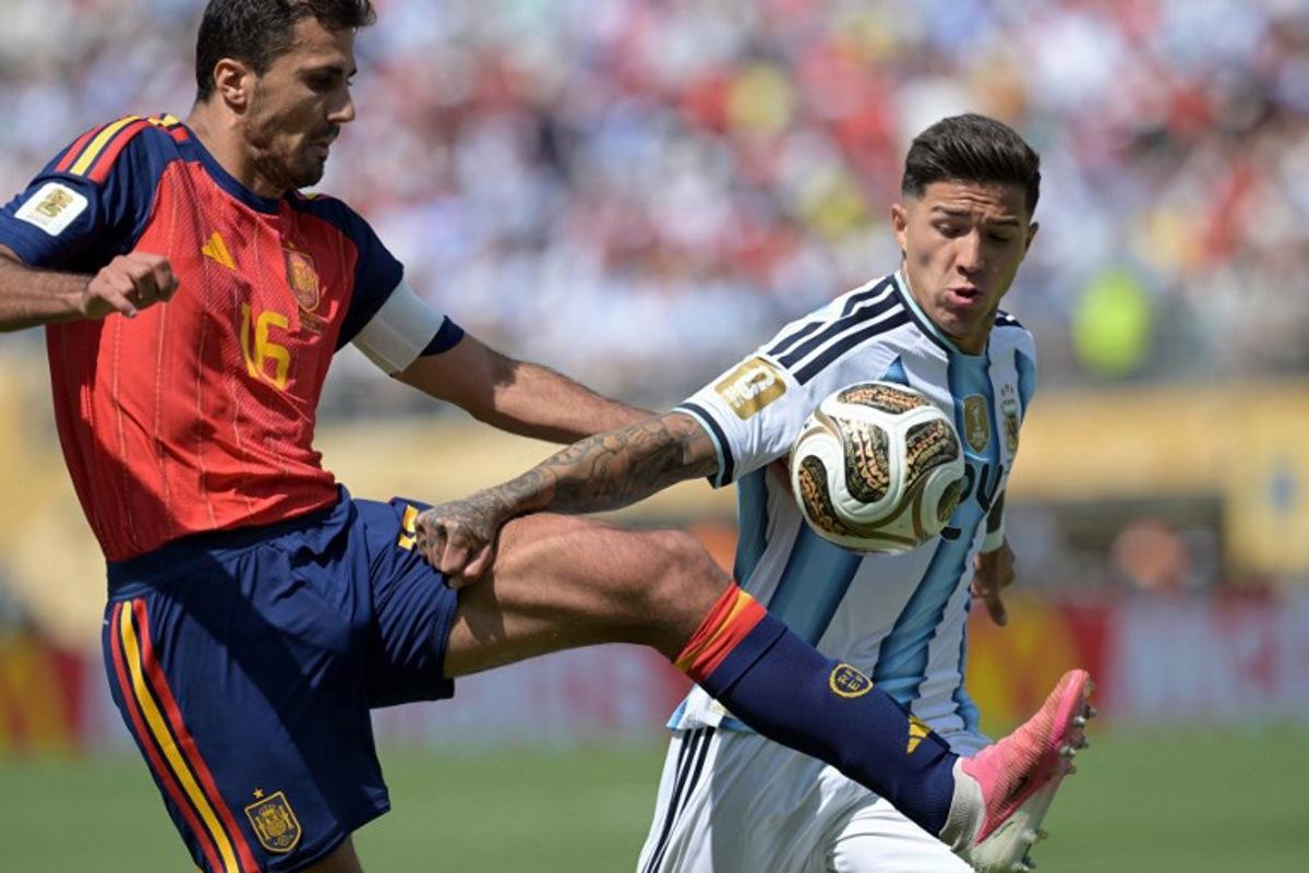 Spain's midfielder #16 Rodri (L) and Argentina's midfielder #24 Enzo Fernandez fight for the ball during the 2026 World Cup football tournament final match between Spain and Argentina at the New York/New Jersey Stadium in East Rutherford on July 19, 2026. JUAN MABROMATA / AFP