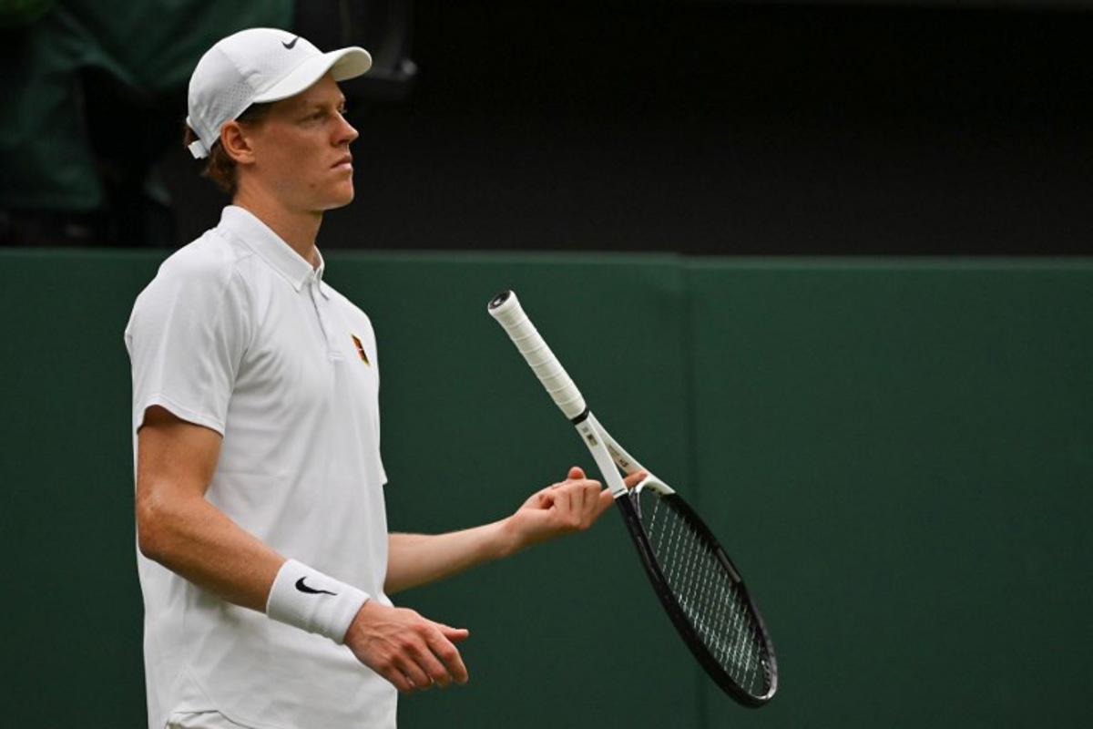 Italy's Jannik Sinner plays with his racket during his men's singles third round tennis match against Spain's Pedro Martinez on the sixth day of the 2025 Wimbledon Championships at The All England Lawn Tennis and Croquet Club in Wimbledon, southwest London, on July 5, 2025. Glyn KIRK / AFP