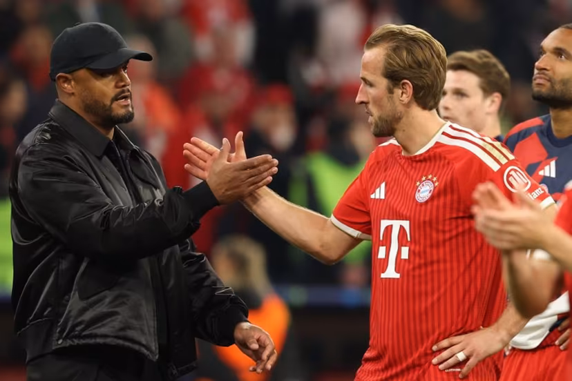 Bayern Munich's Belgian head coach Vincent Kompany (L) shake hands with his players including Bayern Munich's English forward #09 Harry Kane after the UEFA Champions League second-leg, semi-final football match between FC Bayern Munich and Paris Saint-Germain (PSG) in Munich, southern Germany on May 6, 2026. Odd ANDERSEN / AFP